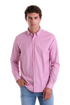 A pink button-down shirt with fine vertical stripes.