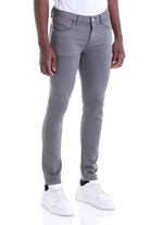 Gray slim-fit jeans with a subtle texture and clean stitching.
