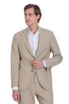 Beige tailored suit jacket with a clean, modern cut and subtle texture.