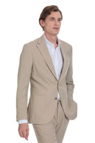 Beige tailored suit jacket with a single button closure and notched lapels.