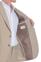 Beige tailored blazer with a clean, structured design and subtle button details.