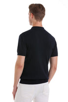 Black ribbed knit polo shirt with a classic collar and short sleeves.