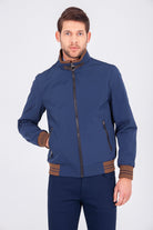Navy blue bomber jacket with brown trim on cuffs, waistband, and collar