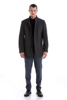 Dark gray woolen men’s overcoat with a structured collar and front button closure.