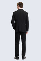 Slim fit black tailored suit with notch lapel and subtle texture ideal for smart casual occasions