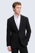 Black slim fit tailored suit jacket with notch lapel and two front buttons for smart casual wear