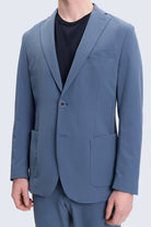 Slim fit blue casual suit blazer with notch lapel, single button closure, and flap pockets for smart casual wear