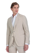 Beige tailored blazer with a single-breasted design and two-button closure.