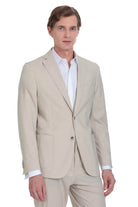 Beige two-button suit jacket with a tailored fit and subtle texture.