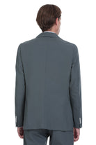A sleek, charcoal-gray tailored suit jacket with a classic double-breasted design and subtle button detailing on the cuffs.