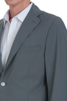 A tailored gray suit jacket with a notched lapel, single-breasted design, and subtle stitching details.