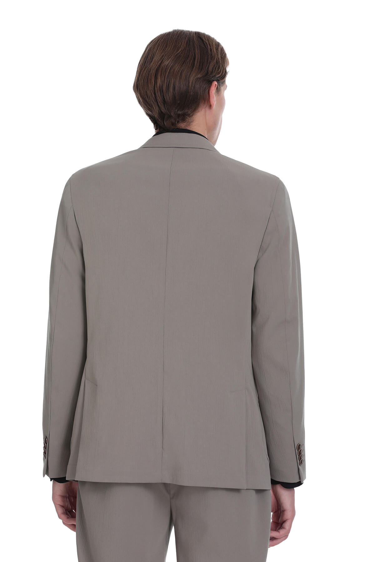 A tailored gray men’s suit jacket with black trim on the cuffs and collar.