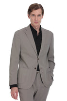 A tailored gray suit jacket with a single-breasted design, two front buttons, and flap pockets.