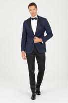 Navy blue tuxedo jacket with black satin lapels and a matching pocket square