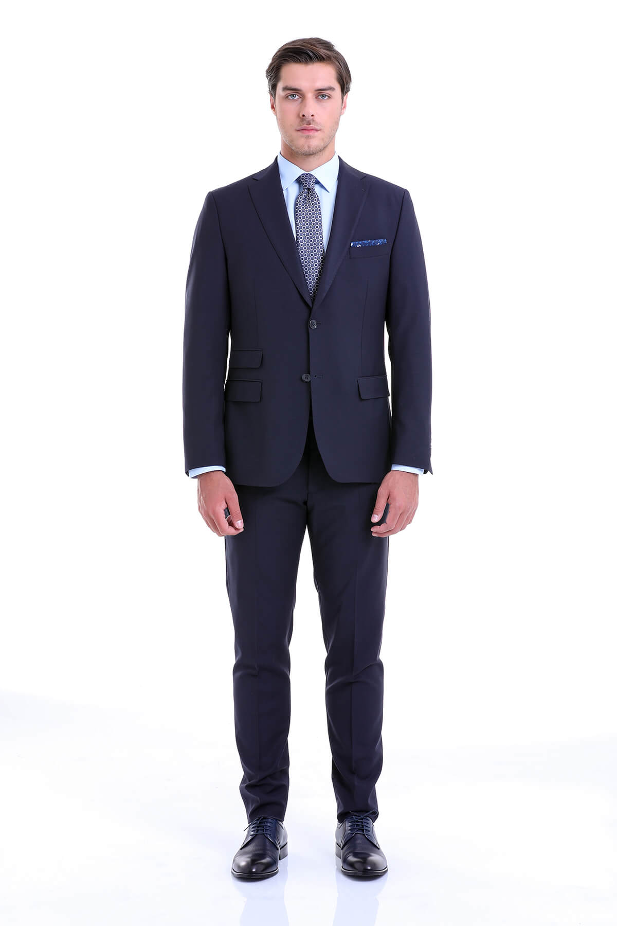 A sharp navy blue tailored suit with a subtle texture, featuring a classic two-button jacket and matching trousers.