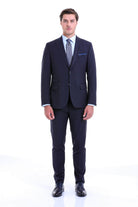 A sharp navy blue tailored suit with a subtle texture, featuring a classic two-button jacket and matching trousers.