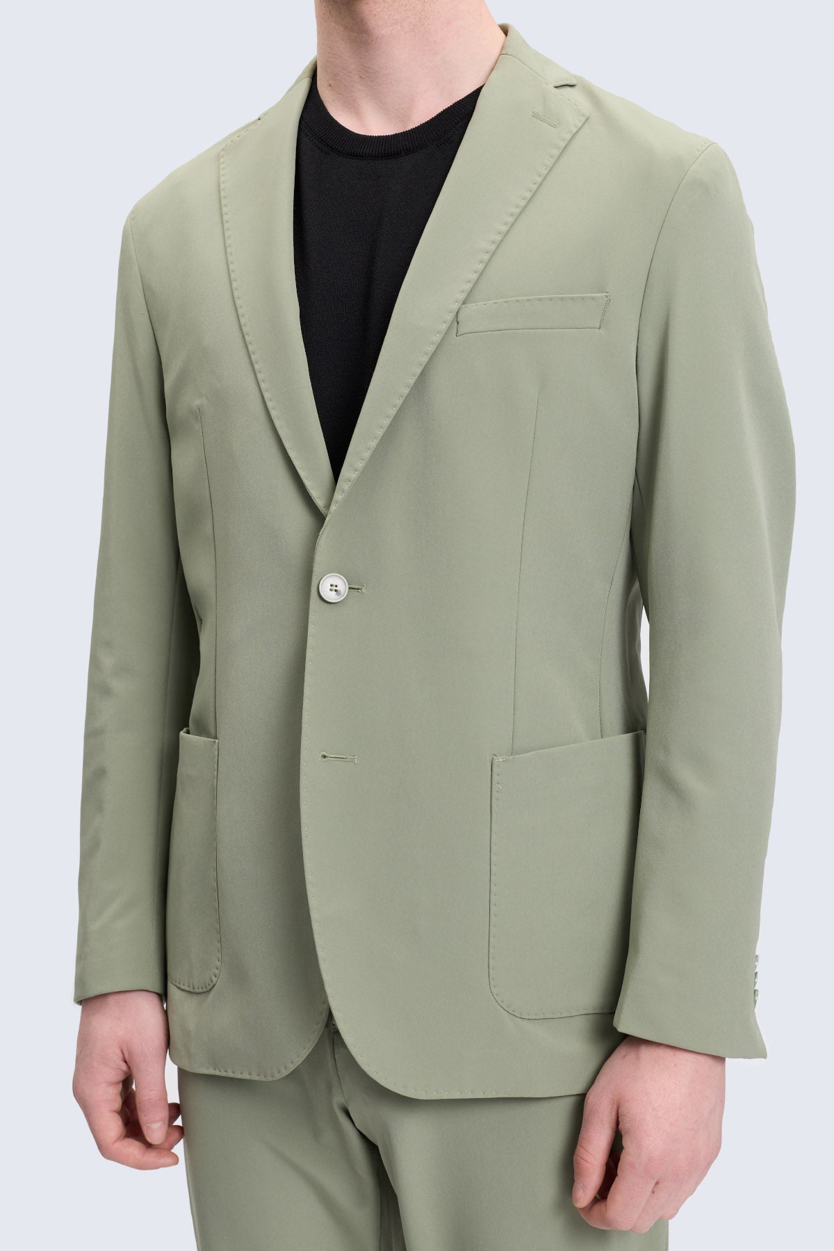 Slim fit sage green single-breasted blazer with notch lapel and subtle texture in a tailored casual suit design