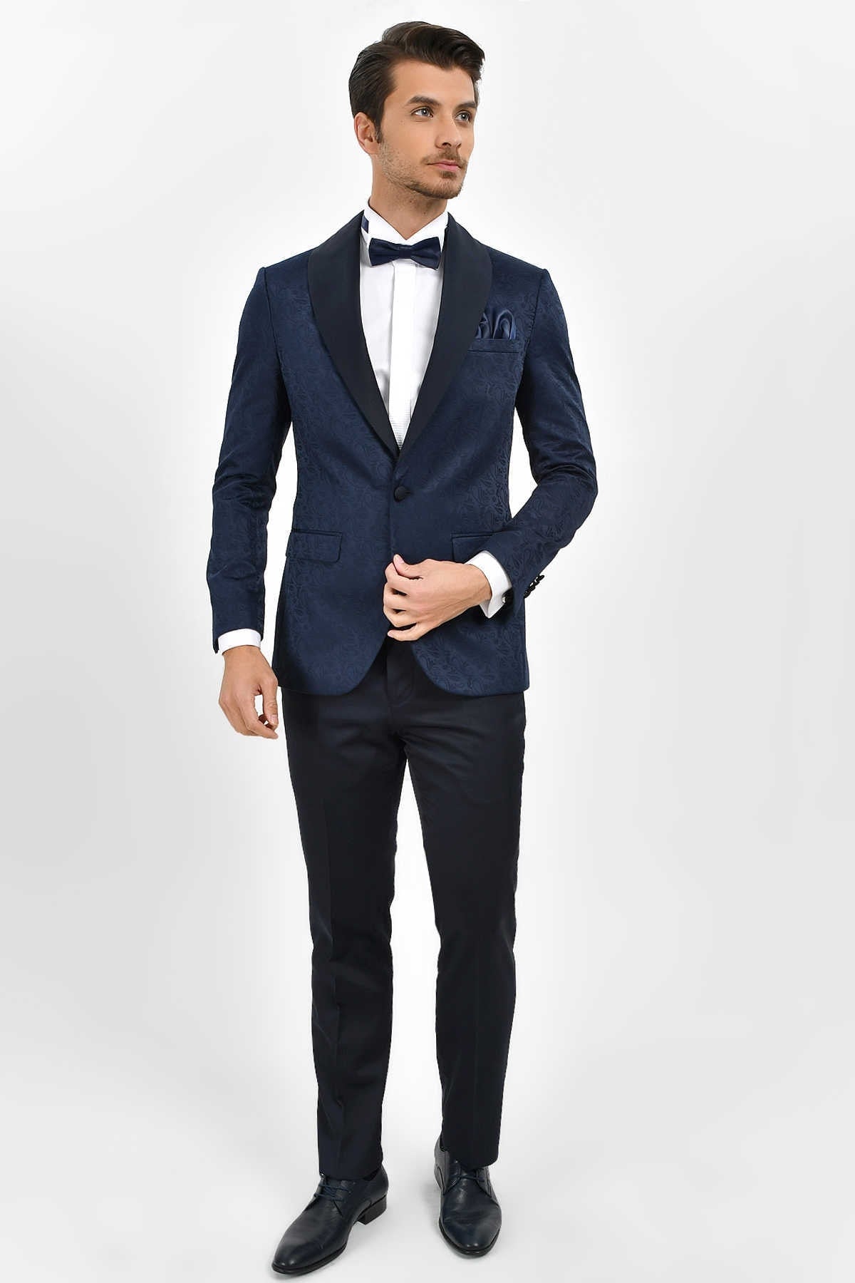 Navy blue tuxedo jacket with black satin lapels and a matching pocket square