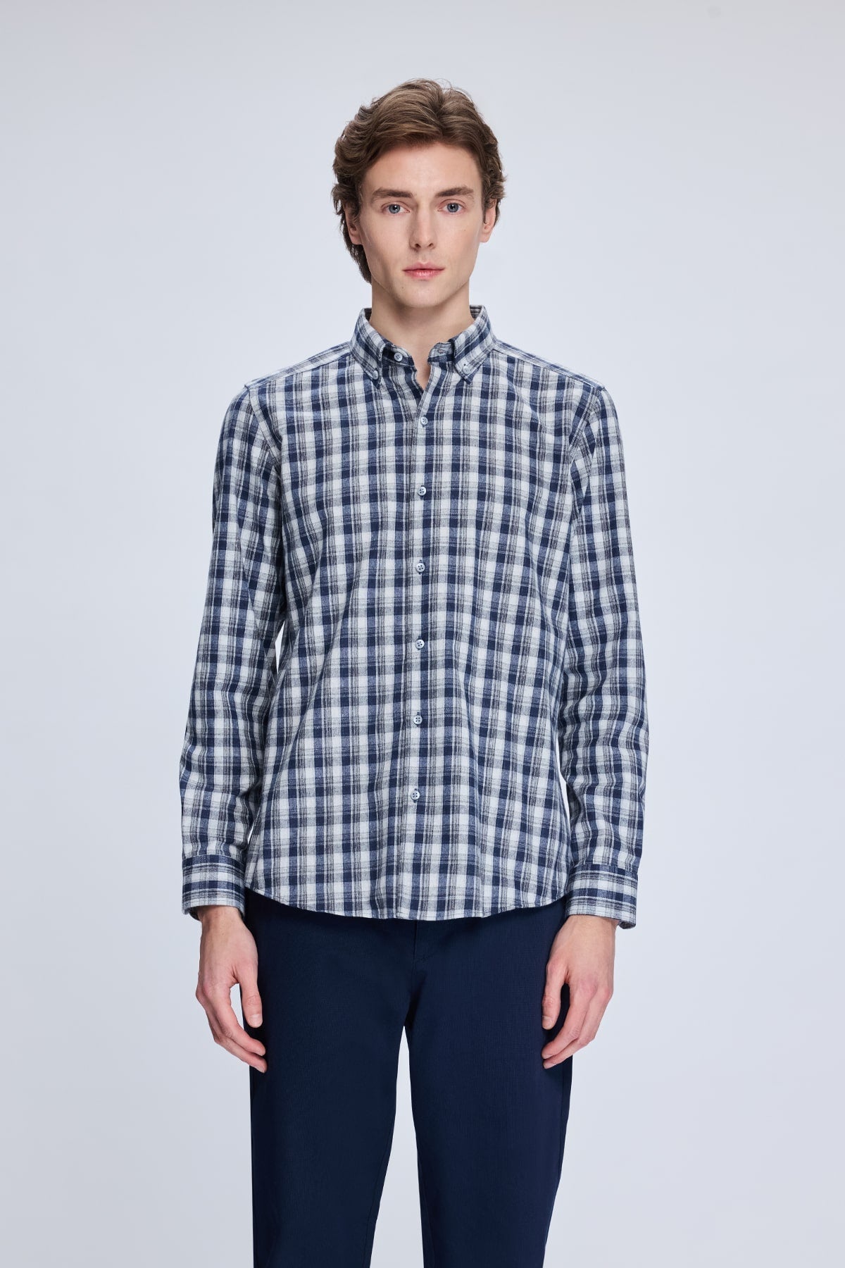 A navy and white plaid button-down shirt with a classic collar.