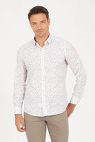 White long-sleeved button-down shirt with a subtle speckled pattern.