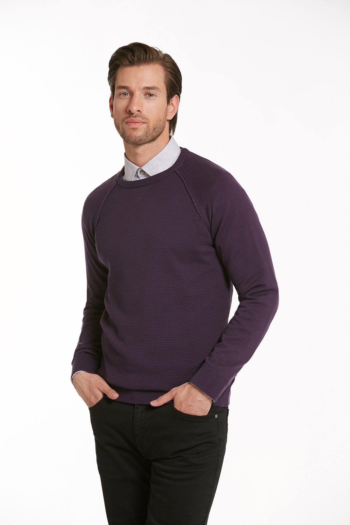 A men’s dark purple crewneck sweater with a subtle textured knit and raglan sleeves.