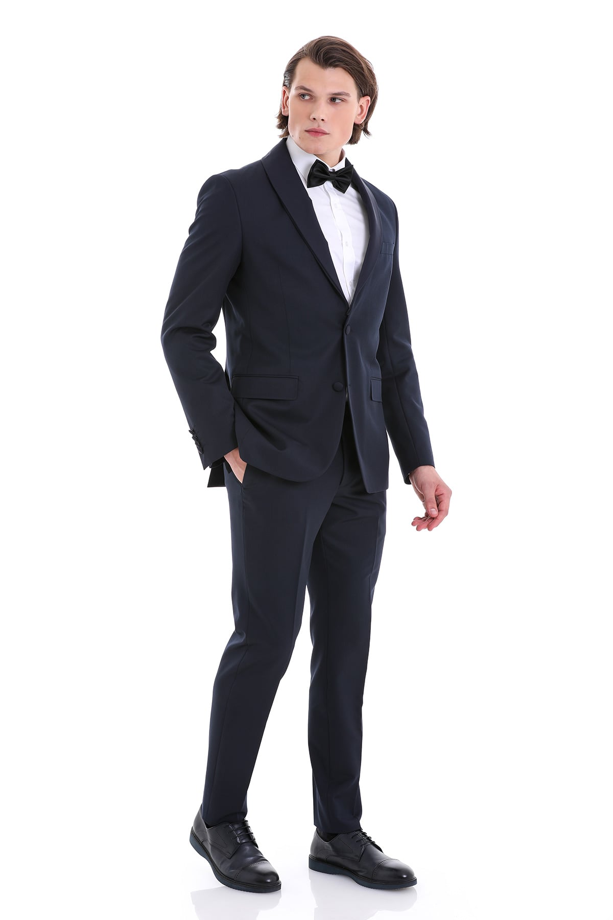 A sleek black tuxedo suit with a notched lapel, paired with a white dress shirt and a matching bow tie.