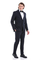 A sleek black tuxedo suit with a notched lapel, paired with a white dress shirt and a matching bow tie.
