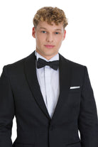 Slim fit black textured tuxedo jacket with shawl lapel and white pocket square for elegant evening events