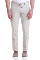 Beige chino trousers with a drawstring waistband and subtle stitching details.