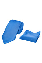 A vibrant royal blue silk tie, neatly rolled and displayed alongside a matching pocket square.