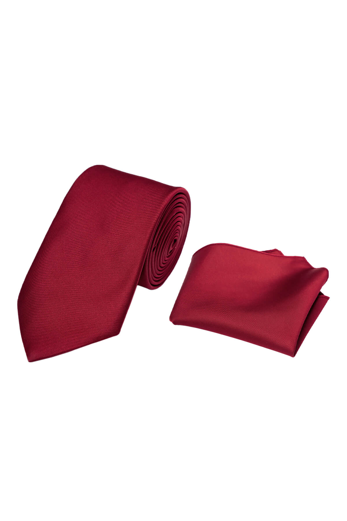 A rich burgundy silk tie and matching pocket square set, elegantly rolled and folded.