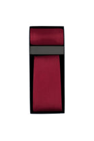 A rich burgundy silk tie neatly folded and presented in a sleek black gift box.