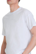 White oversize cotton crew neck t-shirt with small embroidered logo on the left chest