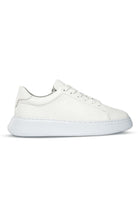 White leather low-top sneaker with a chunky white sole and clean, minimalist design.